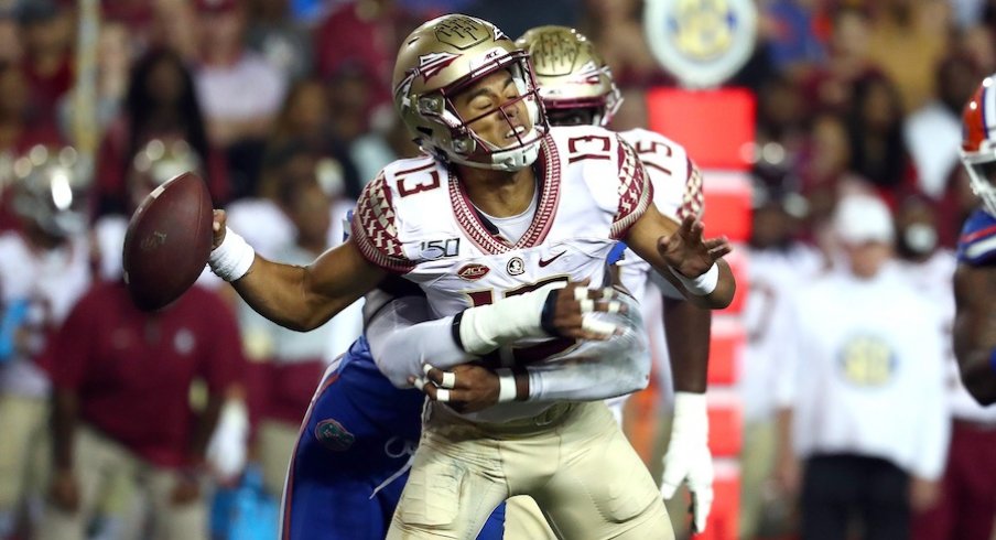 Nov 30, 2019; Gainesville, FL, USA;Florida Gators linebacker Jonathan Greenard (58) sacks Florida State Seminoles quarterback Jordan Travis (13) and forces a fumble during the second quarter at Ben Hill Griffin Stadium. Mandatory Credit: Kim Klement-USA T