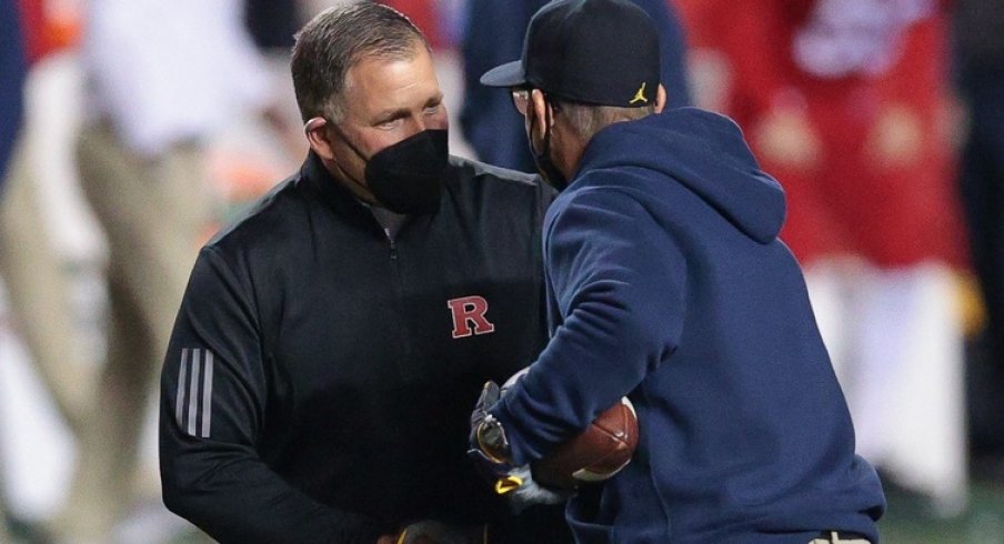 Nov 21, 2020; Piscataway, New Jersey, USA; Rutgers Scarlet Knights head coach Greg Schiano, left, shakes hands with Michigan Wolverines head coach Jim Harbaugh before their game at SHI Stadium. Mandatory Credit: Vincent Carchietta-USA TODAY Sports