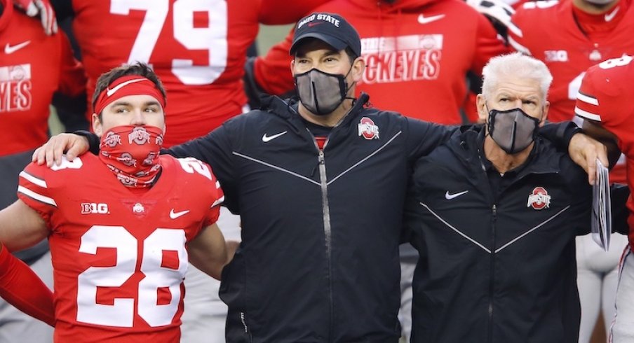 Nov 21, 2020; Columbus, Ohio, USA; Ohio State Buckeyes head coach Ryan Day (center) and defensive coordinator Kerry Coombs(right) and place kicker Dominic DiMaccio (28)after the game against the Indiana Hoosiers at Ohio Stadium. Mandatory Credit: Joseph Maiorana-USA TODAY Sports