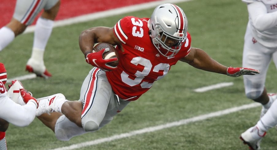 Nov 21, 2020; Columbus, Ohio, USA; Ohio State Buckeyes running back Master Teague III (33) tackled by Indiana Hoosiers defensive back Jamar Johnson (22) during the second quarter at Ohio Stadium. Mandatory Credit: Joseph Maiorana-USA TODAY Sports