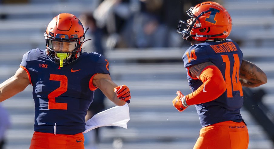 Illinois' Chase Brown and Brian Hightower