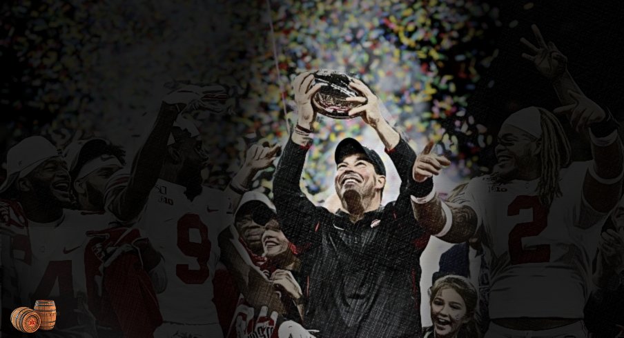 Ohio State Buckeyes head coach Ryan Day raises the Stagg Championship Trophy along with Ohio State Buckeyes wide receiver K.J. Hill Jr. (14), Ohio State Buckeyes wide receiver Binjimen Victor (9) and Ohio State Buckeyes defensive end Chase Young (2) following the Buckeyes' 34-21 victory against the Wisconsin Badgers during the Big Ten Football Championship Game on Saturday, December 7, 2019 at Lucas Oil Stadium in Indianapolis, Indiana. [Joshua A. Bickel/Dispatch]