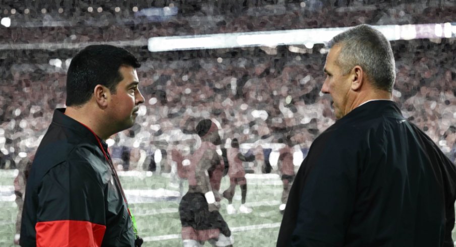 Dec 28, 2019; Glendale, AZ, USA; Ohio State Buckeyes current head coach Ryan Day talks with former head coach Urban Meyer before the 2019 Fiesta Bowl college football playoff semifinal game against the Clemson Tigers at State Farm Stadium. Mandatory Credit: Matthew Emmons-USA TODAY Sports