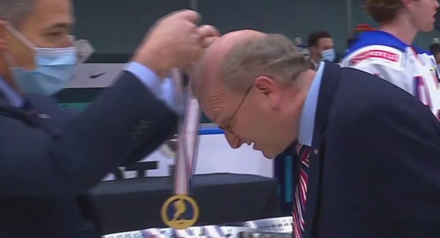 Team USA assistant coach Steve Miller gets his gold medal