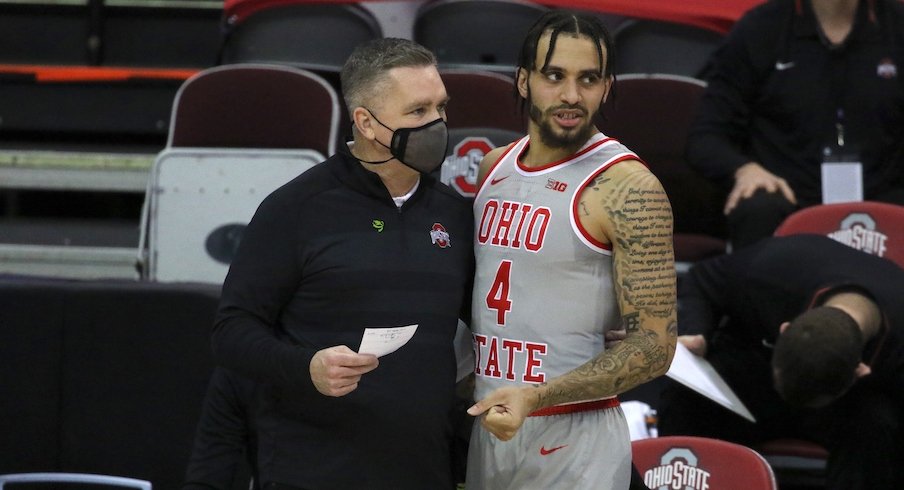 Chris Holtmann and Duane Washington Jr.