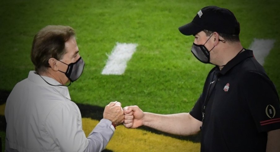 Jan 11, 2021; Miami Gardens, FL, USA; Alabama Crimson Tide head coach Nick Saban (left) greets Ohio State Buckeyes head coach Ryan Day before the 2021 College Football Playoff National Championship Game at Hard Rock Stadium. Mandatory Credit: Douglas DeFelice-USA TODAY Sports