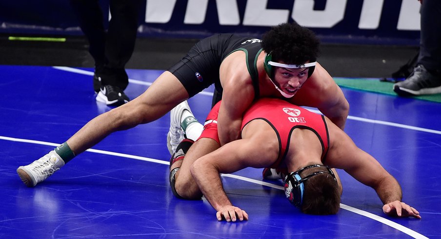 Utah Valley's Demetrius Romero wrestles Ohio State's Kaleb Romero during the NCAA quarterfinals.