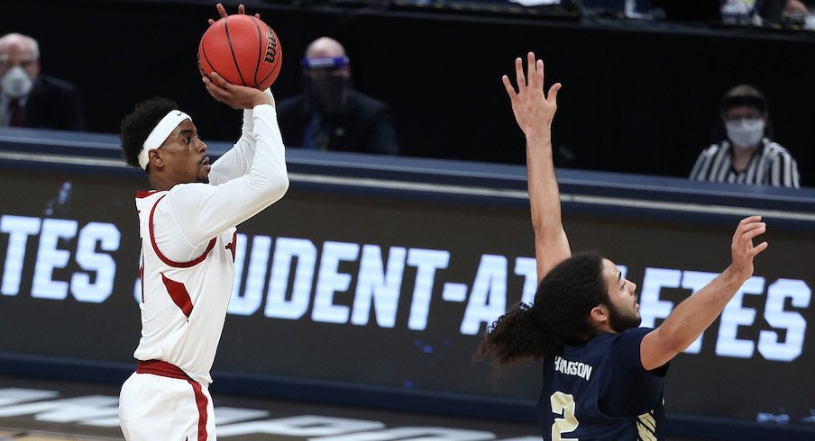 Jalen Tate shoots over Oral Roberts' Kareem Thompson