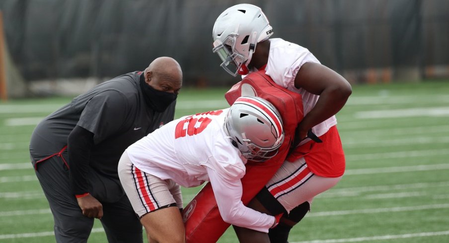 Ohio State players practice tackling