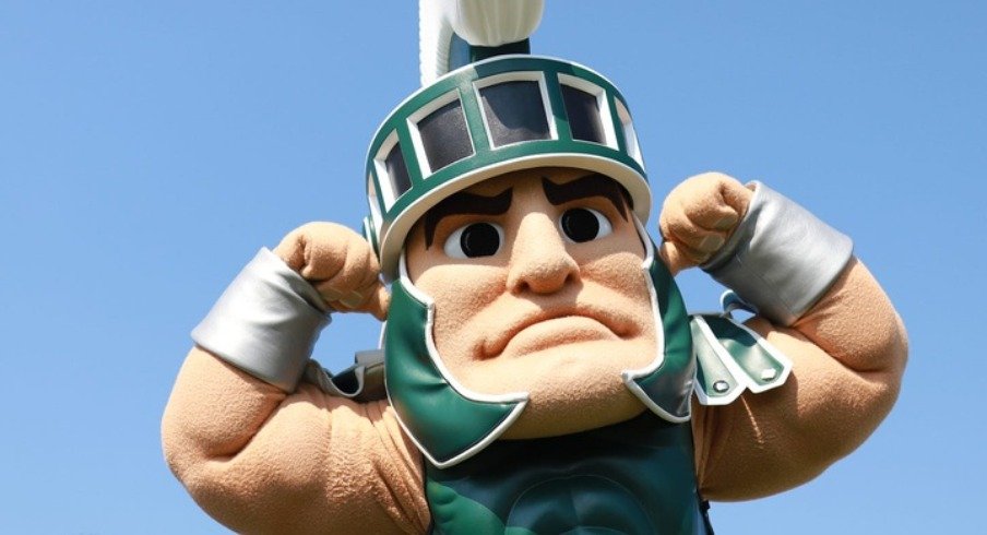 Kids pose with Sparty during the 2019 Metro Detroit Youth Day at Belle Isle Park in Detroit on Wednesday, July 10, 2019
