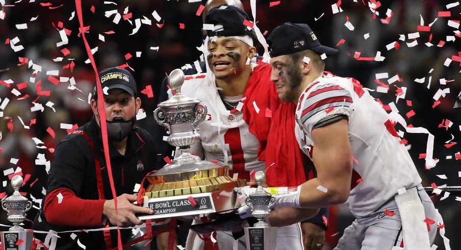 Buckeyes lift a trophy after a bowl win against Clemson