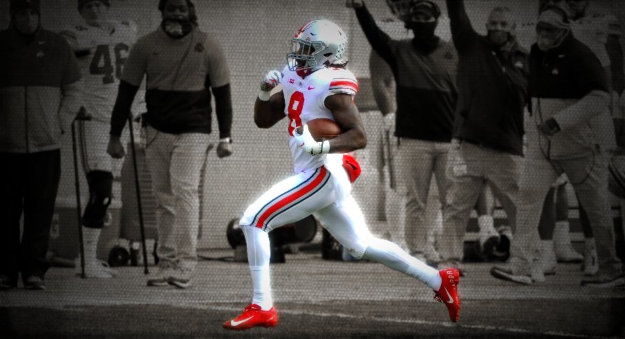 Ohio State Buckeyes running back Trey Sermon (8) scores a touchdown during the third quarter of a NCAA Division I football game between the Michigan State Spartans and the Ohio State Buckeyes on Saturday, Dec. 5, 2020 at Spartan Stadium in East Lansing, Michigan. Ohio State Buckeyes At Michigan State Spartans