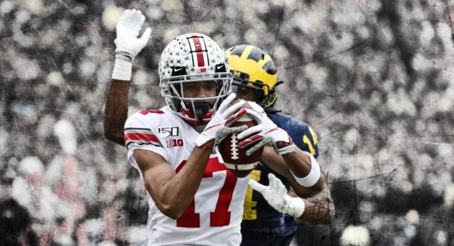 Nov 30, 2019; Ann Arbor, MI, USA; Ohio State Buckeyes wide receiver Chris Olave (17) makes a reception for a touchdown defended by Michigan Wolverines defensive back Josh Metellus (14) in the first half at Michigan Stadium. Mandatory Credit: Rick Osentoski-USA TODAY Sports