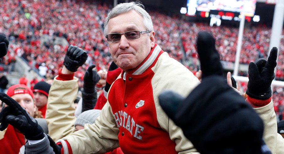 Jim Tressel is carried off the field in 2011