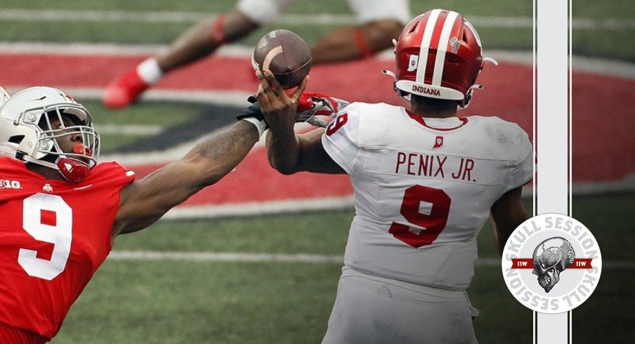 Ohio State Buckeyes defensive end Zach Harrison (9) hits the arm of Indiana Hoosiers quarterback Michael Penix Jr. (9) as he throws the ball during the first quarter in their NCAA Division I football game on Saturday, Nov. 21, 2020 at Ohio Stadium in Columbus, Ohio.