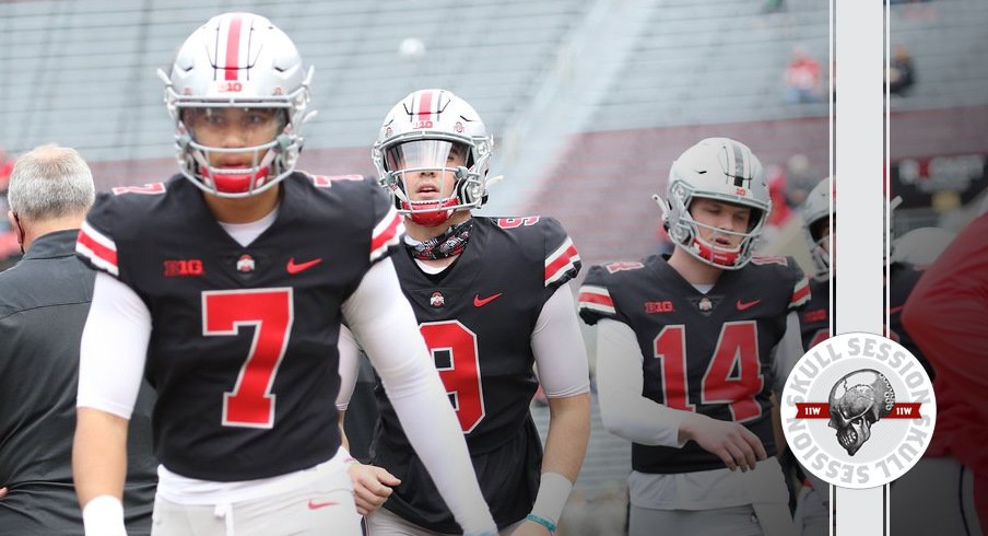 Ohio State quarterbacks walk on the field.