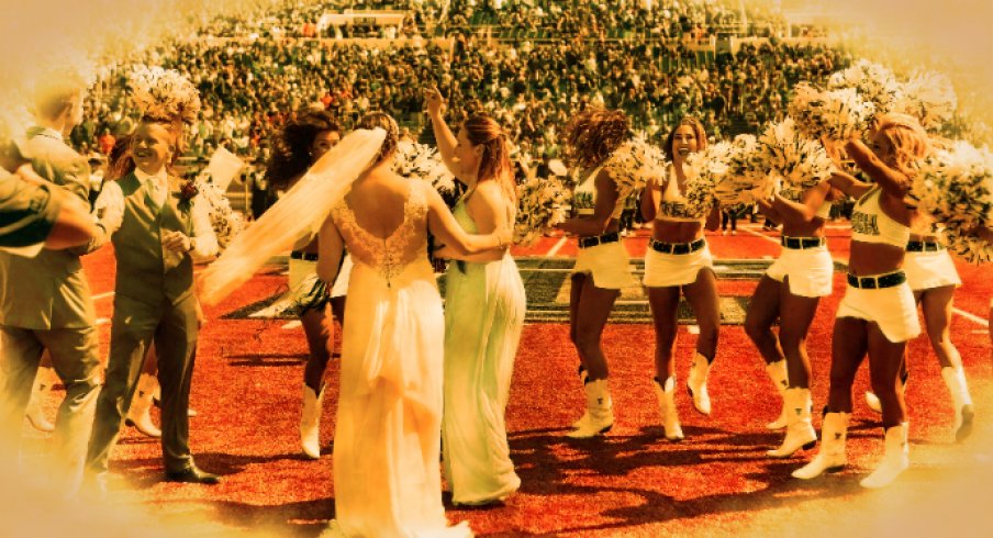 Sep 29, 2018; Lubbock, TX, USA; Kelsey Hohnstein and the Texas Tech Red Raiders pom squad celebrate during her wedding to Andrew Reinhart at half time of a game between the Texas Tech Red Raiders and the West Virginia Mountaineers at Jones AT&T Stadium. Mandatory Credit: Michael C. Johnson-USA TODAY Sports