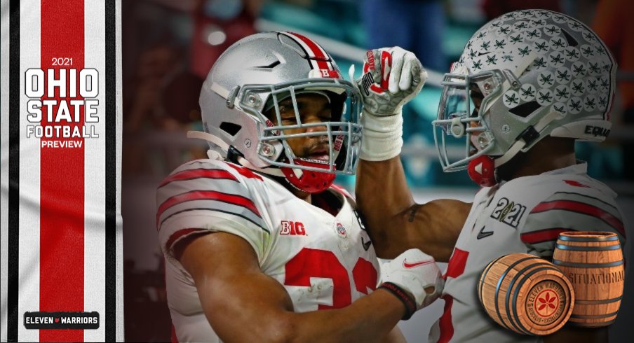 Jan 11, 2021; Miami Gardens, Florida, USA; Ohio State Buckeyes running back Master Teague III (33) celebrates with wide receiver Garrett Wilson (5) after scoring a touchdown during the first quarter against the Alabama Crimson Tide in the 2021 College Football Playoff National Championship Game.