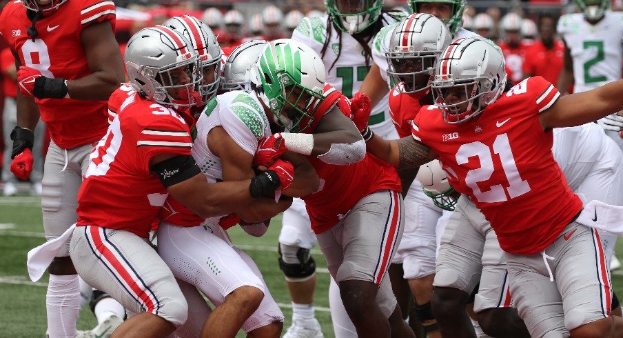 Cody Simon and Palaie Gaoteote combine for a tackle.