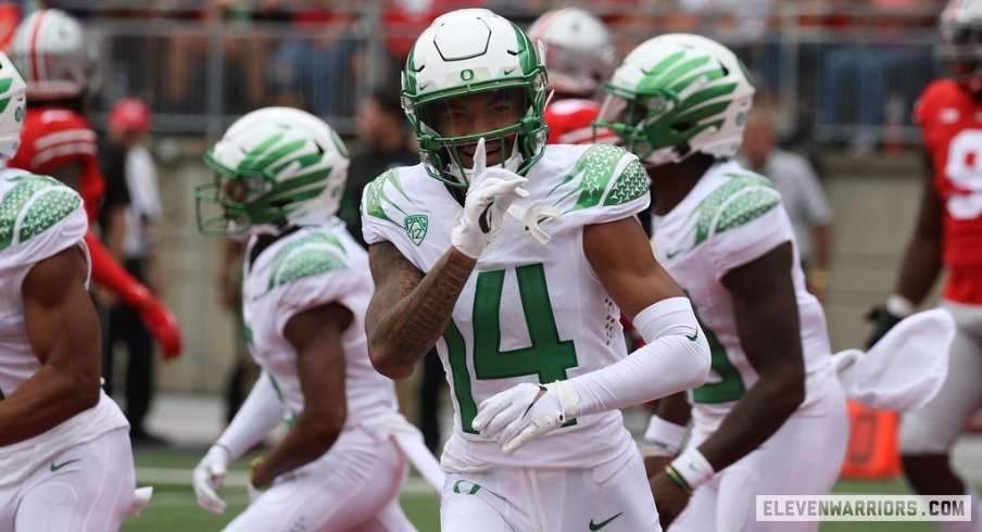 Oregon's Kris Hutson quiets the Ohio Stadium crowd after a 30-yard reception.