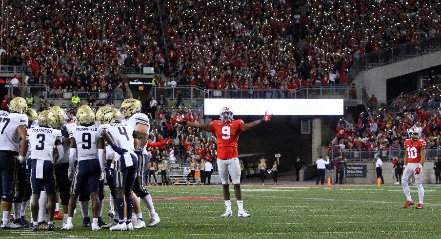 Zach Harrison takes in the night crowd at Ohio Stadium. 