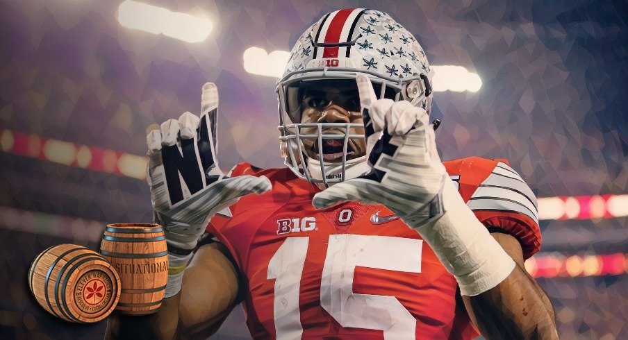 Ohio State Buckeyes running back Ezekiel Elliott (15) celebrates scoring a touchdown on a 33-yard run during the first quarter of the College Football Playoff National Championship against the Oregon Ducks at AT&T Stadium in Arlington, Texas on Jan. 12, 2015. 