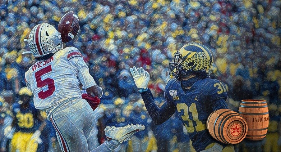 Nov 30, 2019; Ann Arbor, MI, USA; Ohio State Buckeyes wide receiver Garrett Wilson (5) makes a reception on Michigan Wolverines defensive back Vincent Gray (31) in the first half at Michigan Stadium. Mandatory Credit: Rick Osentoski-USA TODAY Sports