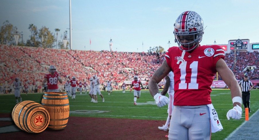 Sat., Jan. 1, 2022; Pasadena, California, USA; Ohio State Buckeyes wide receiver Jaxon Smith-Njigba (11) flexes after scoring a touchdown during the second quarter of the 108th Rose Bowl Game between the Ohio State Buckeyes and the Utah Utes at the Rose Bowl.