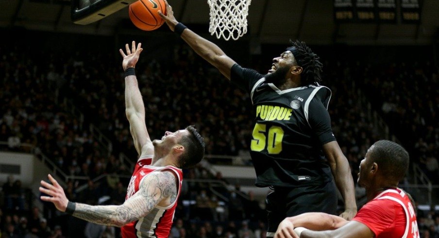 Trevion Williams blocks Kyle Young’s shot