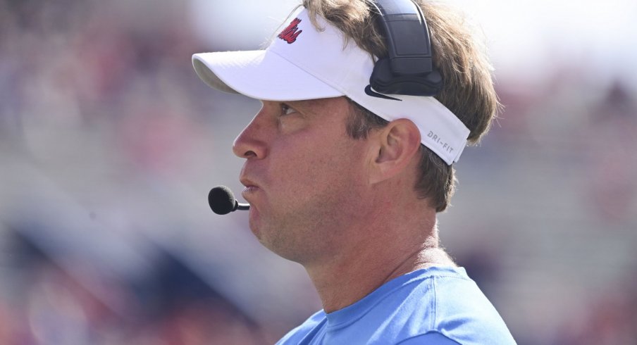 Lane Kiffin stares into the sky with dread.