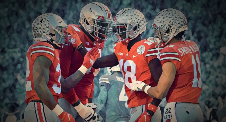 Jan 1, 2022; Pasadena, California, USA; Ohio State Buckeyes wide receiver Marvin Harrison Jr. (18) celebrates with wide receiver Jaxon Smith-Njigba (11) and running back TreVeyon Henderson (32) against the Utah Utes during the 2022 Rose Bowl game at the Rose Bowl. Mandatory Credit: Orlando Ramirez-USA TODAY Sports