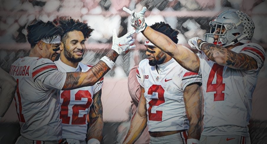 Ohio State Buckeyes wide receiver Jaxon Smith-Njigba (11) and Ohio State Buckeyes wide receiver Julian Fleming (4) celebrate after a play during Saturday's NCAA Division I football game against the Nebraska Cornhuskers at Memorial Stadium in Lincoln, Neb., on November 6, 2021. 