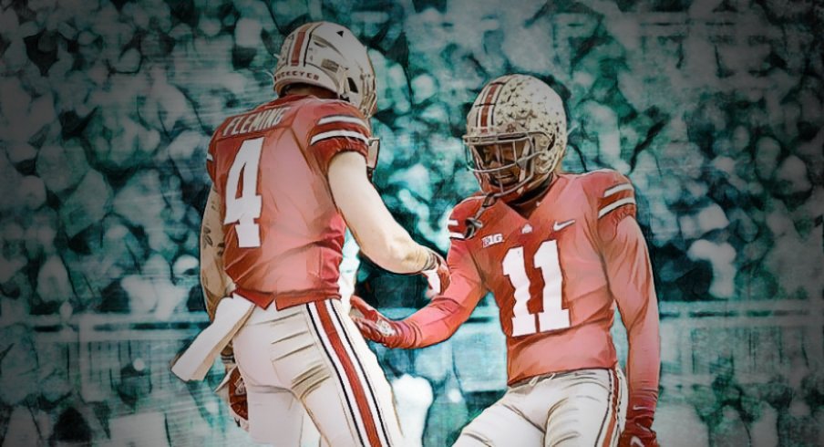 Ohio State Buckeyes wide receiver Jaxon Smith-Njigba (11) congratulates wide receiver Julian Fleming (4) on scoring a touchdown during the second quarter of the NCAA football game against the Michigan State Spartans at Ohio Stadium in Columbus on Saturday, Nov. 20, 2021. Michigan State Spartans At Ohio State Buckeyes Football