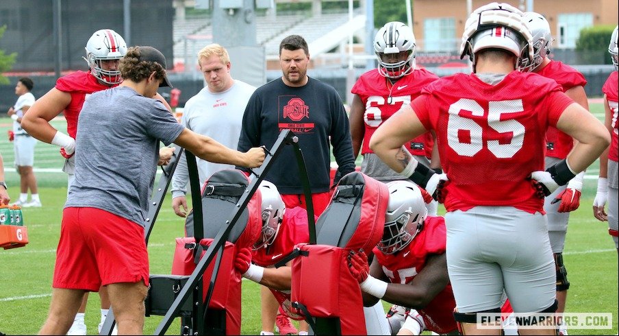 Justin Frye coaches offensive linemen at Ohio State’s second practice of preseason camp.