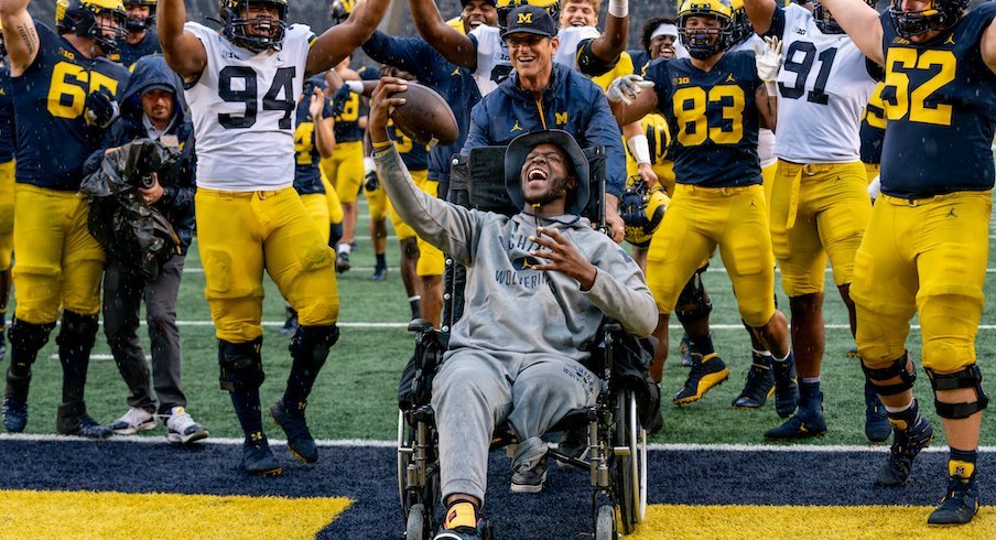 Dametrius Walker scores a touchdown in Michigan Stadium.