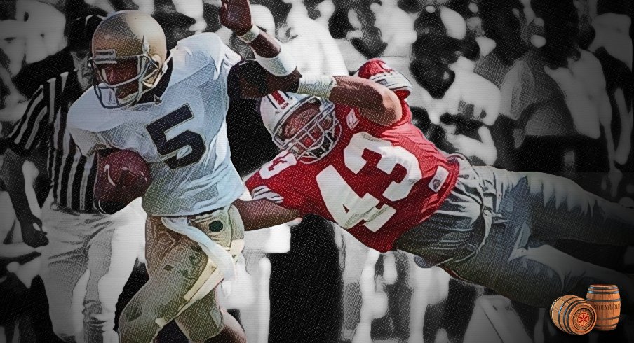 Notre Dame's Emmett Mosley tries to escape from OSU Buckeye Ryan Miller (#43)