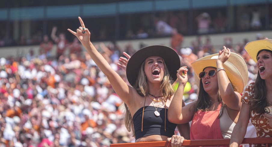 Texas Longhorns fans celebrate a fumble by the Alabama Crimson Tide.