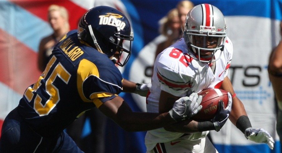 Sep 19, 2009; Cleveland, OH, USA; Ohio State Buckeyes receiver Ray Small (82) returns a punt against Toledo Rockets safety Isaiah Ballard (45) at Cleveland Browns Stadium. Mandatory Credit: Matthew Emmons-USA TODAY Sports