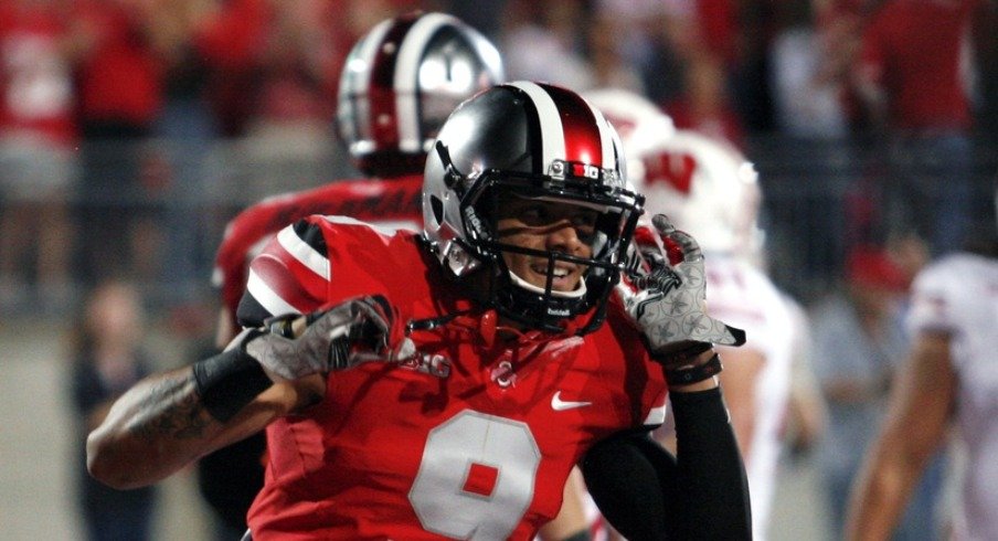 Sep 28, 2013; Columbus, OH, USA; Ohio State Buckeyes wide receiver Devin Smith (9) smiles after making a touchdown catch against the Wisconsin Badgers at Ohio Stadium. Mandatory Credit: Raj Mehta-USA TODAY Sports