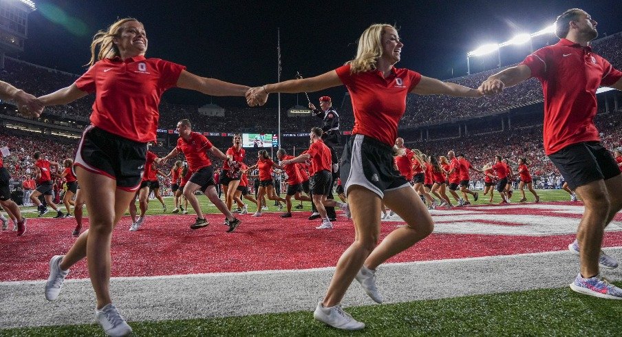 Sep 17, 2022; Columbus, Ohio, USA; Ohio State Buckeyes alumni cheerleaders circle the endzone following a touchdown during the second half of the NCAA Division I football game against the Toledo Rockets at Ohio Stadium. Ohio State won 77-21. Mandatory Credit: Adam Cairns-The Columbus Dispatch Ncaa Football Toledo Rockets At Ohio State Buckeyes