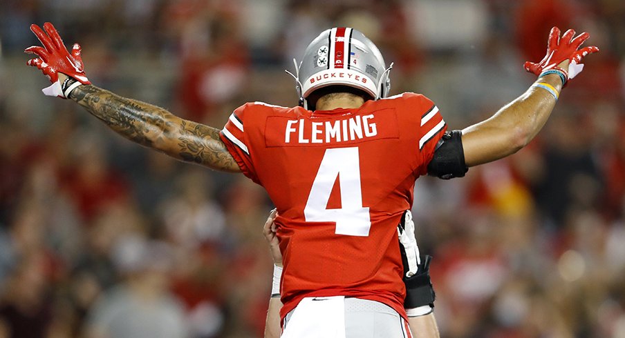 Ohio State wide receiver Julian Fleming celebrates one of his two touchdowns against Toledo