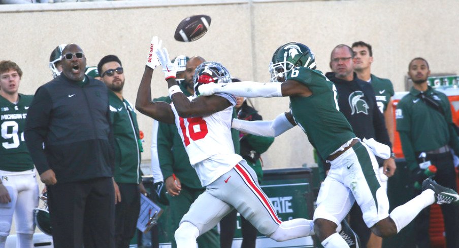 Ohio State wide receiver Marvin Harrison, Jr. makes a catch against Michigan State
