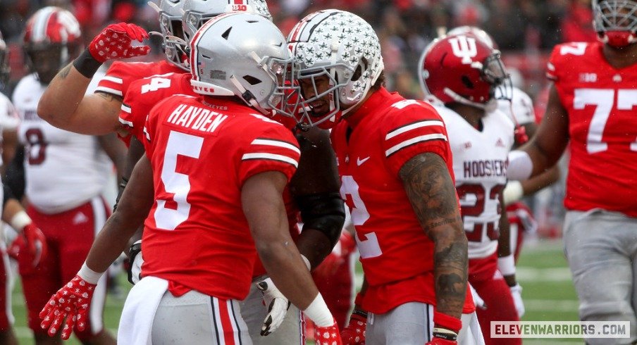 Dallan Hayden and Emeka Egbuka celebrate a touchdown.