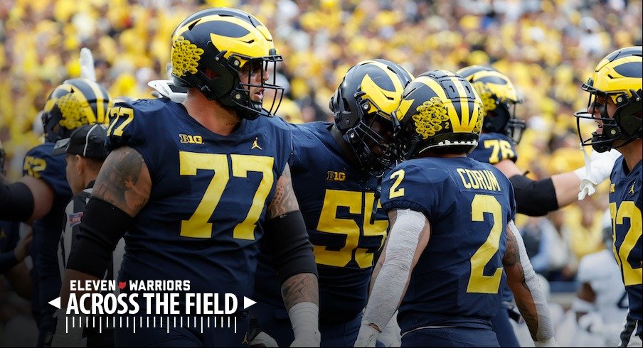 Blake Corum and the Michigan Wolverines celebrate a touchdown.