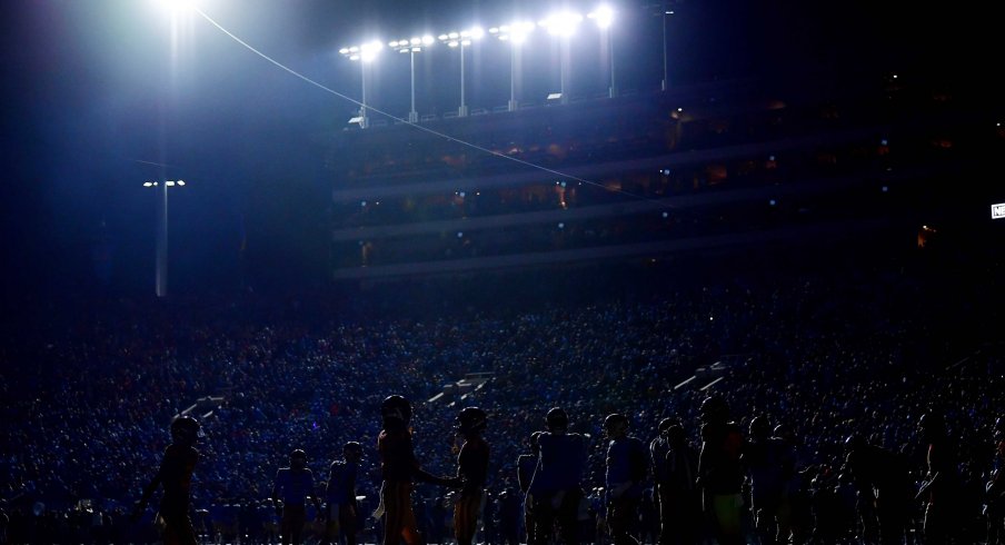 Stadium lights flash during the Victory Bell rivalry game between the USC and UCLA football teams
