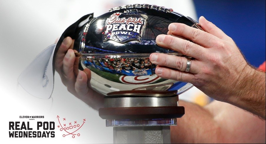 Kirby Smart holding the Peach Bowl trophy after Georgia’s win over Cincinnati on Jan. 1, 2021.