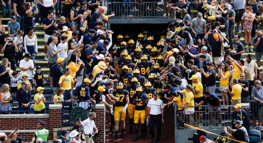 Michigan football players exiting the tunnel