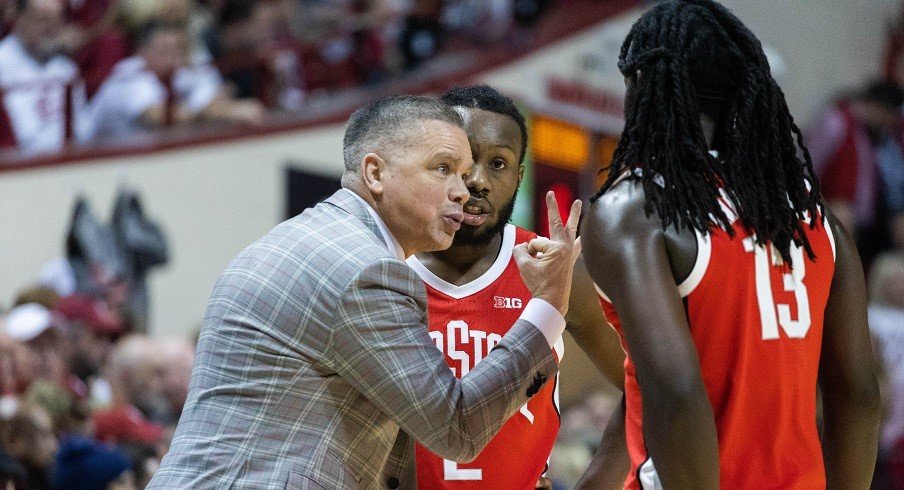 Chris Holtmann with Isaac Likekele and Bruce Thornton