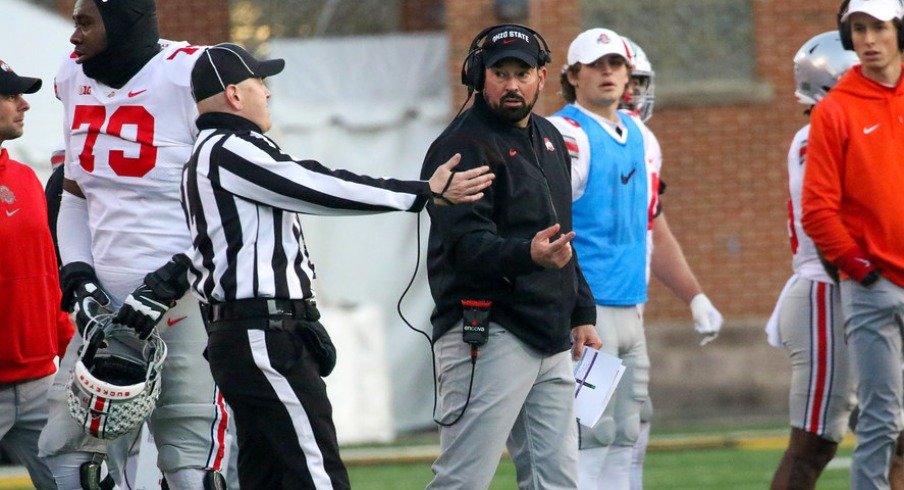 Ohio State head football coach Ryan Day talks with a ref