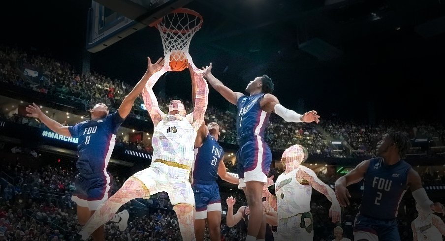 Mar 17, 2023; Columbus, Ohio, USA; Purdue Boilermakers center Zach Edey (15) grabs a rebound between Fairleigh Dickinson Knights forward Sean Moore (11) and guard Joe Munden Jr. (1) during the first round of the NCAA men s basketball tournament at Nationwide Arena